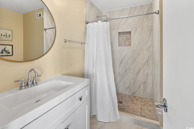 bathroom with tile flooring, a shower with shower curtain, and vanity