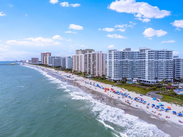 bird's eye view with a water view and a view of the beach