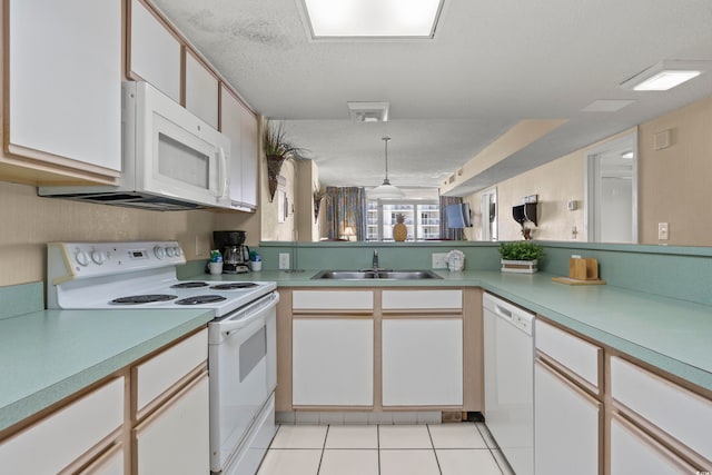 kitchen featuring light tile flooring, white appliances, a textured ceiling, sink, and white cabinetry