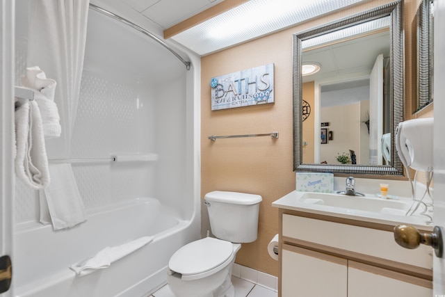 full bathroom with tile flooring, toilet, large vanity, and shower / bath combo