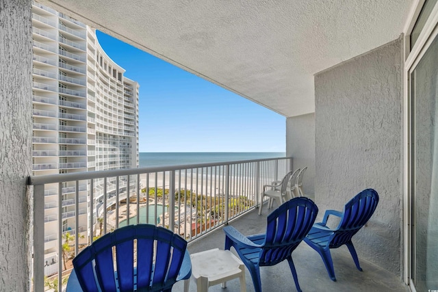 balcony featuring a water view