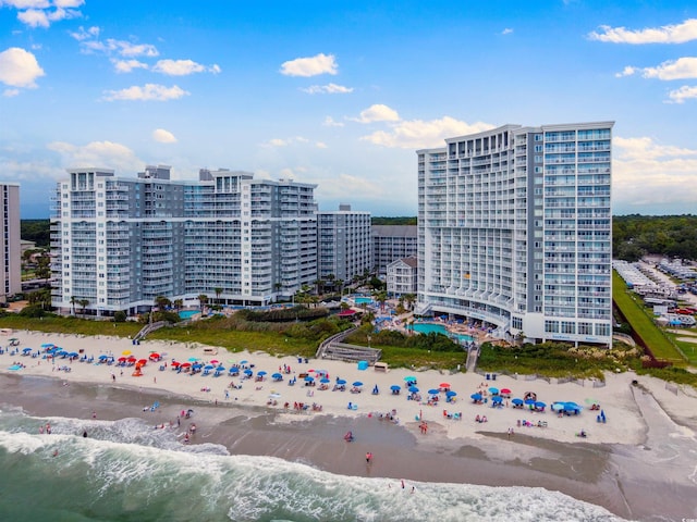 view of property featuring a water view and a view of the beach