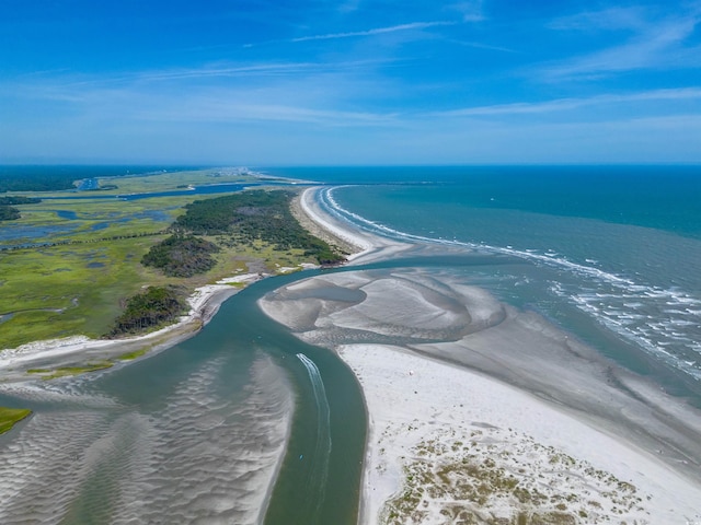 drone / aerial view with a water view and a beach view