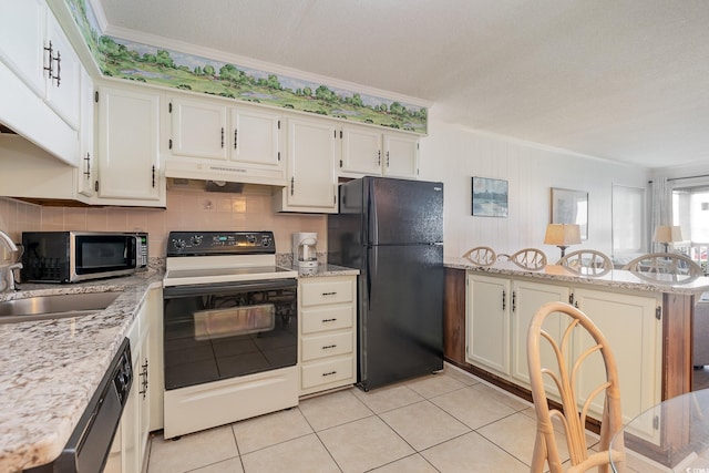 kitchen with ornamental molding, stainless steel appliances, and light stone countertops