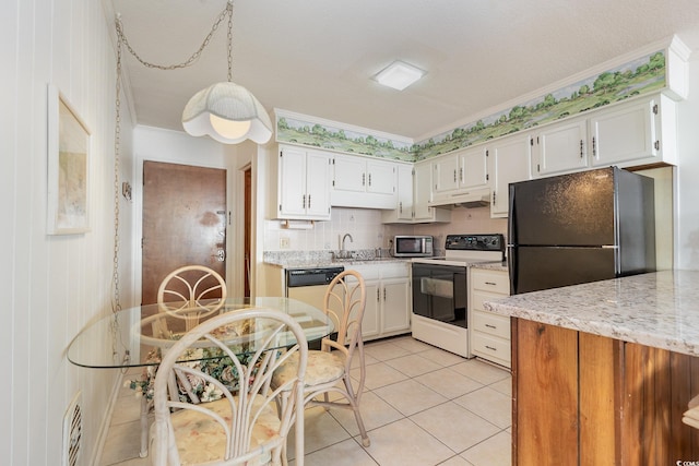 kitchen with white cabinetry, ornamental molding, stainless steel appliances, and light tile patterned floors