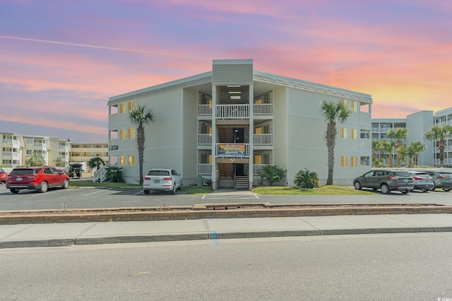 view of outdoor building at dusk