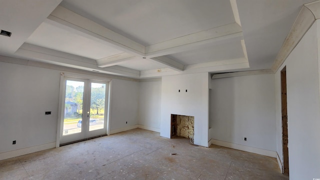 unfurnished living room featuring french doors, beam ceiling, and a fireplace