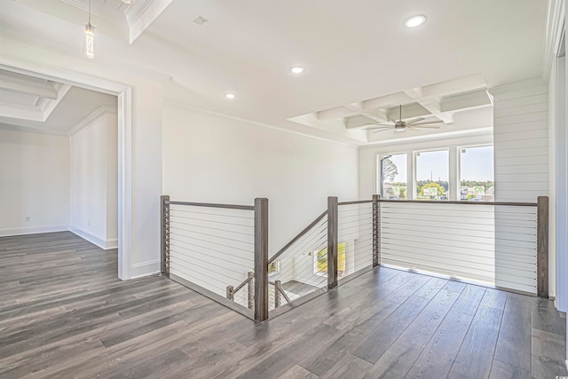 hall with beamed ceiling, coffered ceiling, crown molding, and dark hardwood / wood-style flooring