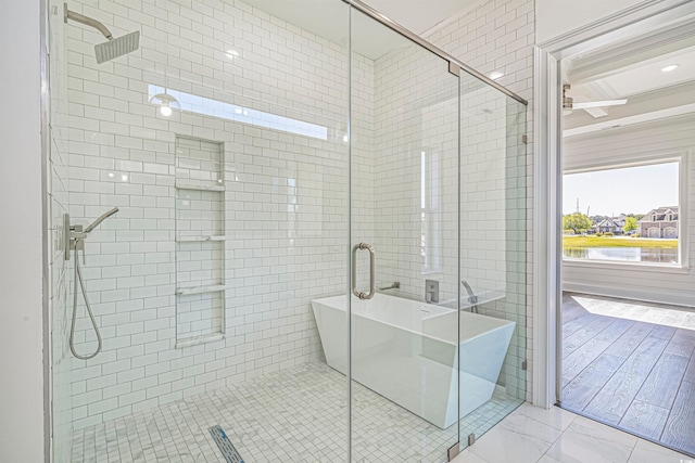 bathroom with hardwood / wood-style flooring and plus walk in shower