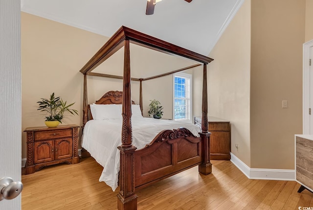 bedroom with ceiling fan, crown molding, lofted ceiling, and light hardwood / wood-style floors