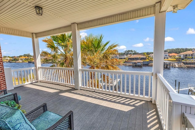 deck featuring a water view