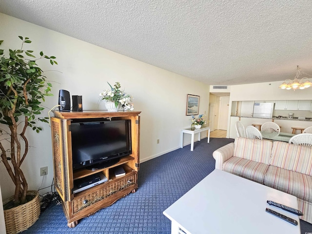 9820 Queensway Blvd Unit 501, Myrtle Beach, SC 29572 - living area with carpet flooring, a chandelier, and a textured ceiling