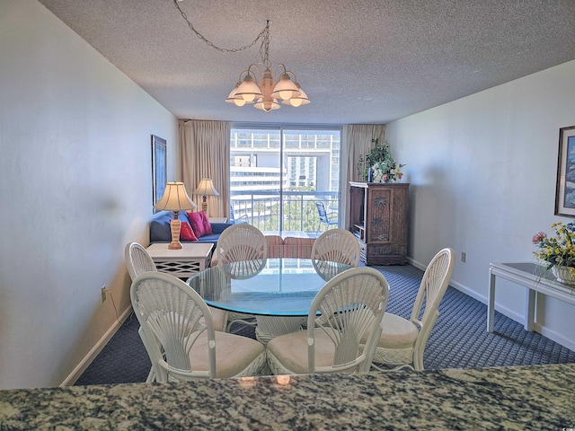 dining area with an inviting chandelier, carpet, and a textured ceiling