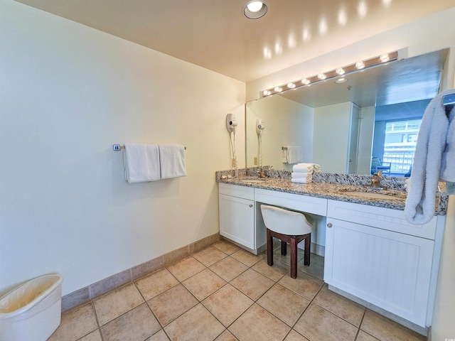 bathroom with tile floors and dual bowl vanity