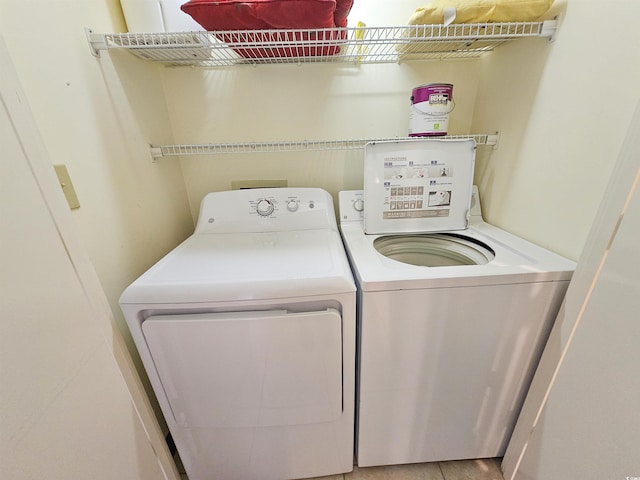 clothes washing area featuring washing machine and dryer