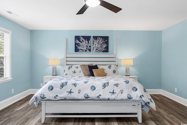 bedroom featuring dark hardwood / wood-style flooring and ceiling fan