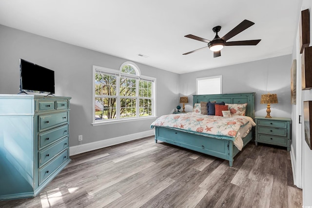 bedroom with hardwood / wood-style floors and ceiling fan