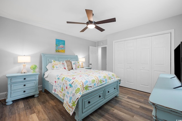 bedroom with dark hardwood / wood-style flooring, a closet, and ceiling fan