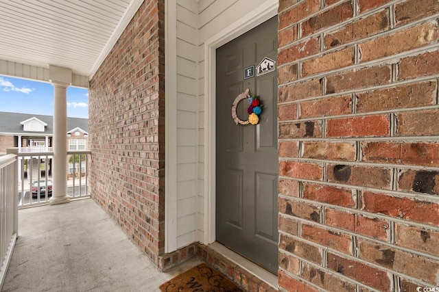 property entrance with covered porch