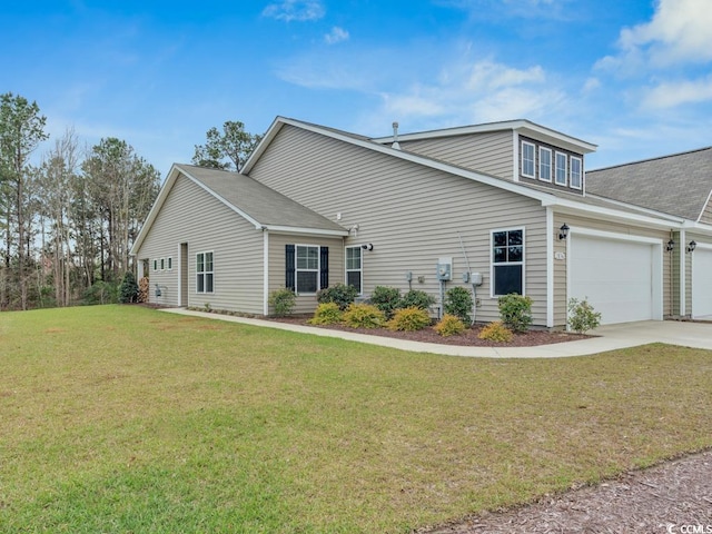 view of front property with a garage and a front lawn