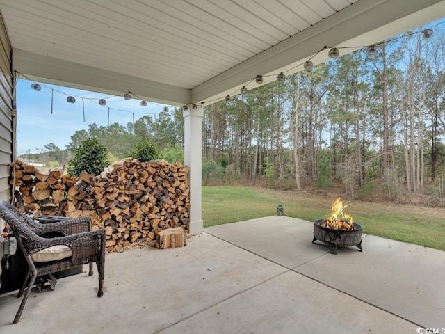 view of terrace featuring an outdoor fire pit