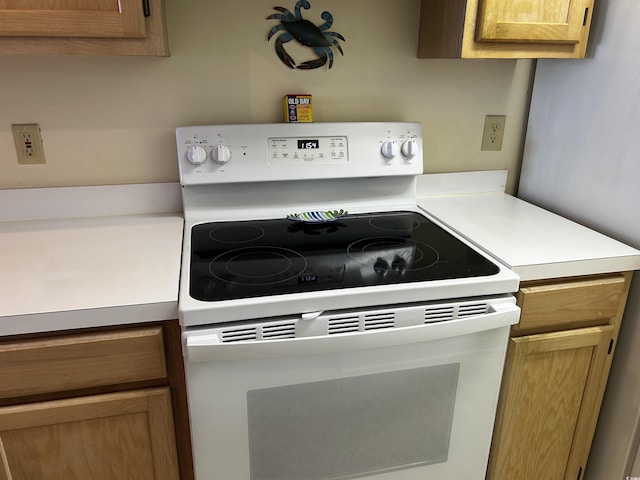 kitchen featuring white electric stove