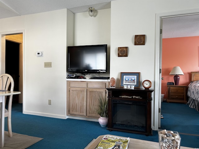 living room with dark colored carpet