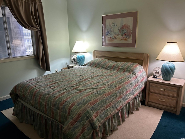 bedroom featuring light carpet