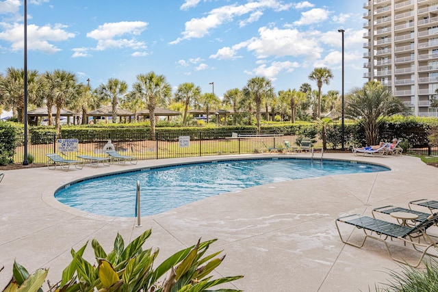 view of swimming pool with a patio