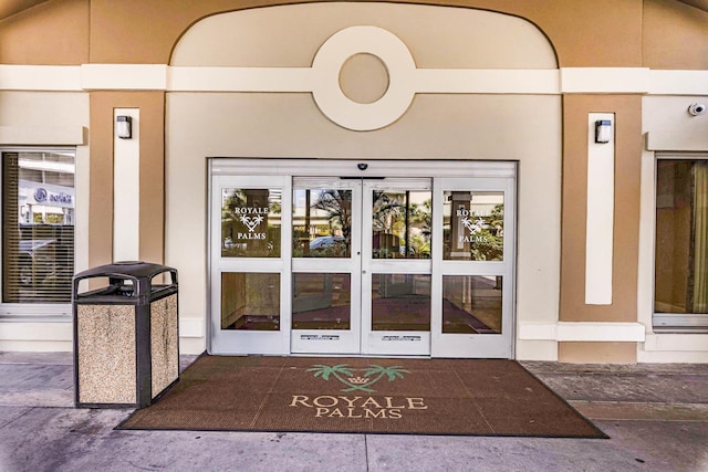 view of exterior entry featuring french doors