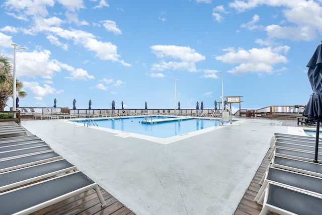 view of swimming pool with a patio area