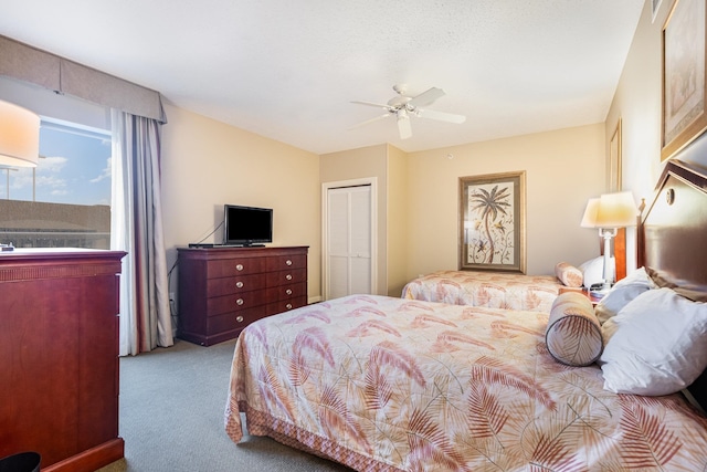 bedroom featuring a closet, carpet, and ceiling fan