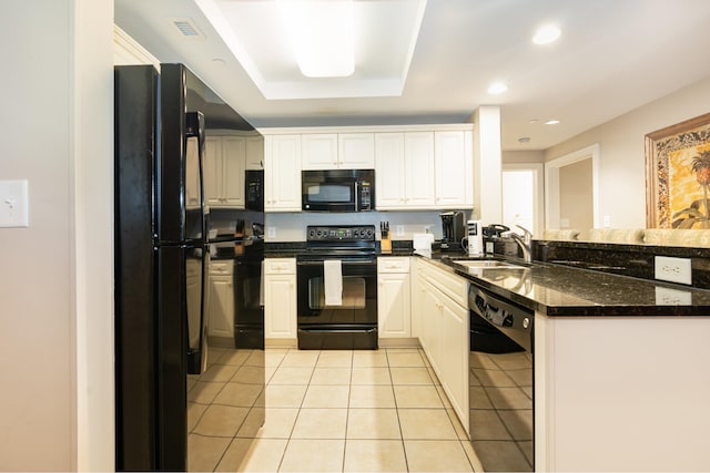 kitchen featuring black appliances, sink, kitchen peninsula, light tile patterned floors, and white cabinetry