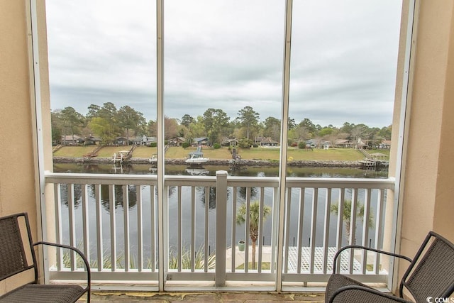 balcony featuring a water view