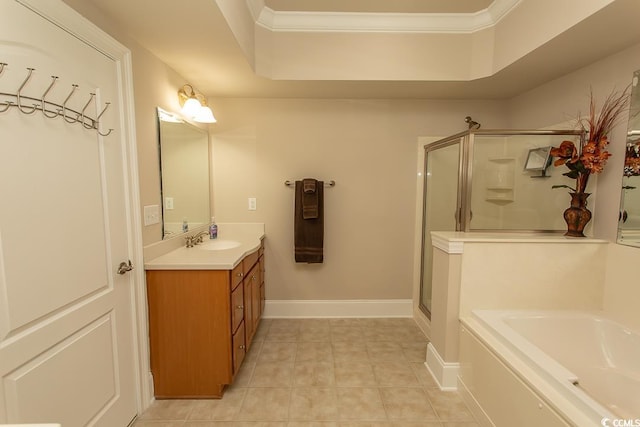 bathroom featuring ornamental molding, tile floors, vanity, and independent shower and bath