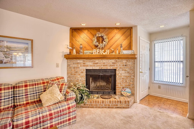 carpeted living room featuring a fireplace and a textured ceiling