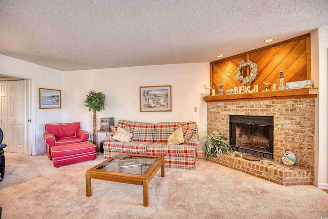 living room with carpet, a textured ceiling, a brick fireplace, and wooden walls