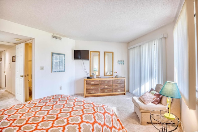 carpeted bedroom with a textured ceiling