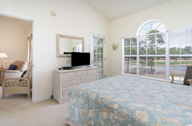 bedroom featuring light carpet, access to outside, and lofted ceiling