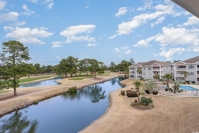 view of pool featuring a water view