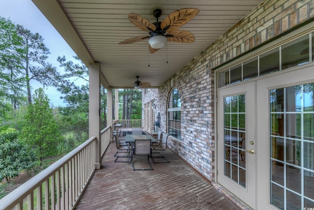 deck with ceiling fan and french doors