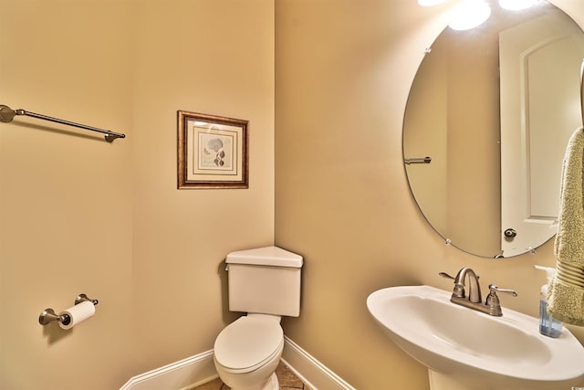 bathroom featuring sink and toilet