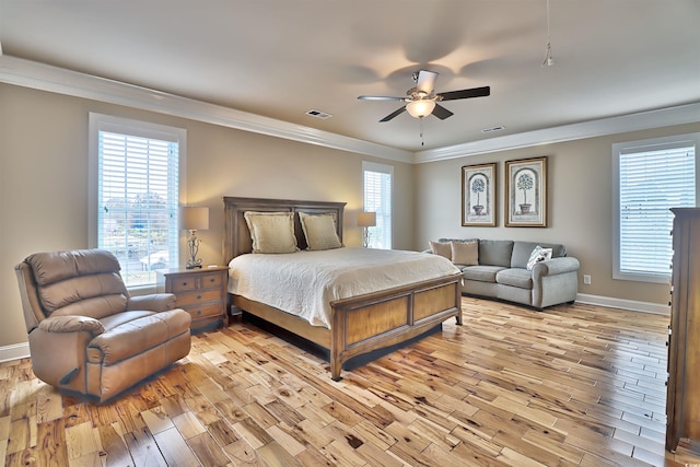 bedroom featuring ceiling fan, crown molding, and hardwood / wood-style flooring