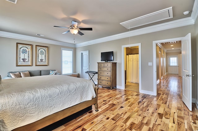 bedroom featuring light hardwood / wood-style flooring, ceiling fan, crown molding, and multiple windows