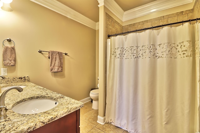 bathroom featuring ornamental molding, tile floors, vanity, and toilet