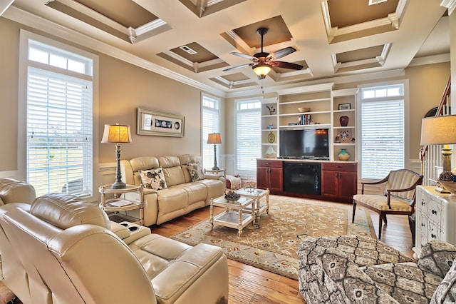 living room with hardwood / wood-style floors, ceiling fan, and a healthy amount of sunlight