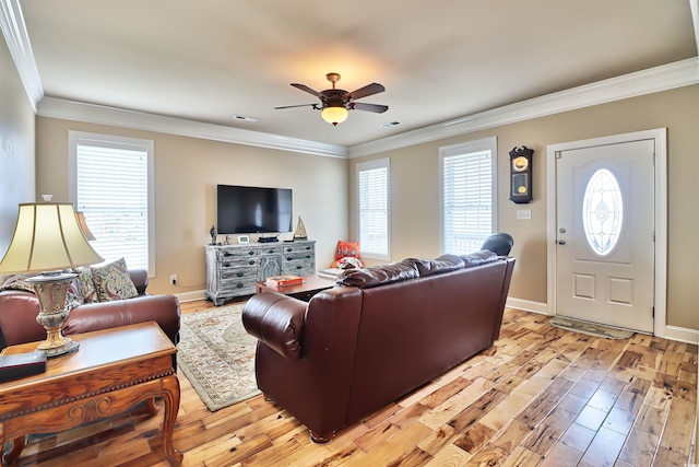 living room with ceiling fan, light hardwood / wood-style floors, and ornamental molding