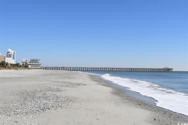 property view of water featuring a beach view