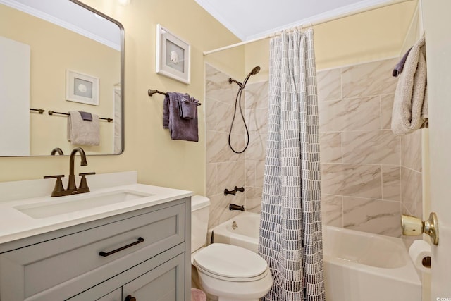 full bathroom with ornamental molding, vanity, shower / tub combo, and toilet