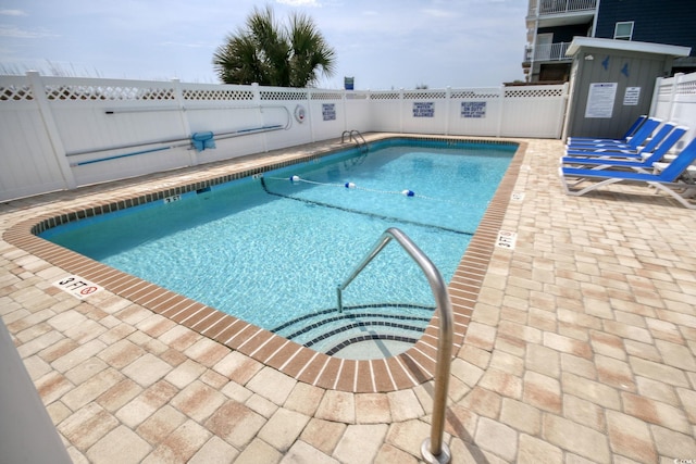 view of swimming pool featuring a patio